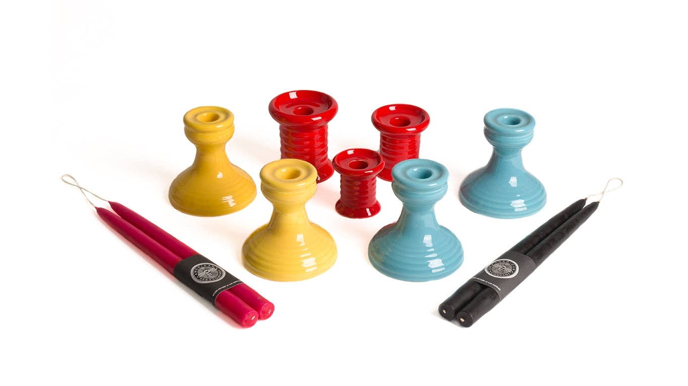 colored candlestick holders with red and black candles