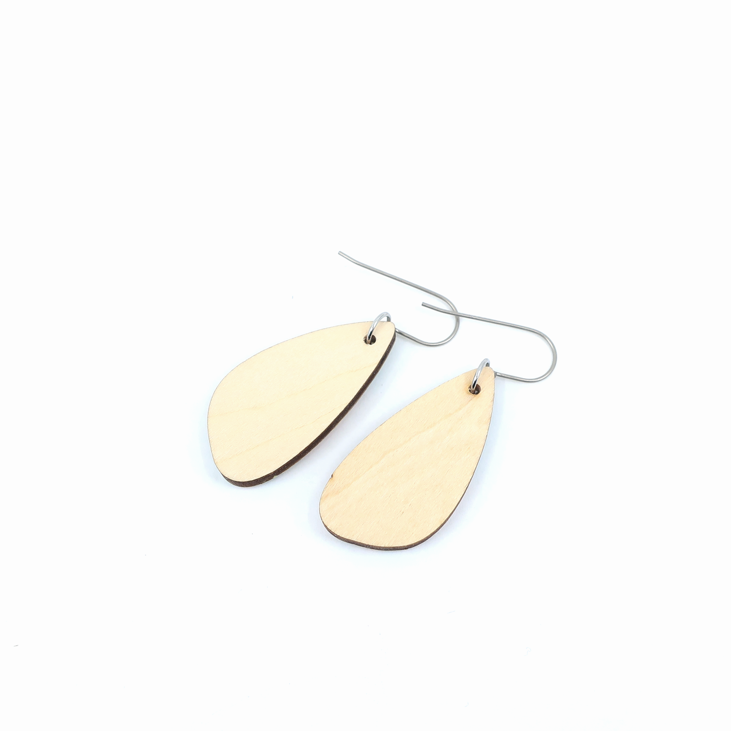 Stylish navy and pink modern marble dangle earrings displayed elegantly, ideal for sensitive ears due to titanium wire hooks.