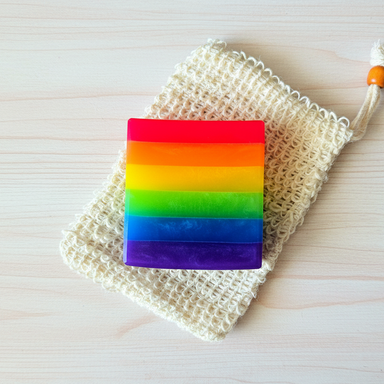 Close-up of Rainbow Pride Handcrafted Soap, highlighting the colorful layers and joyful scents of orange, lime, and sweet berries.
