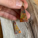 Stylish Triangle Dangle Earrings Flower in various colors, ideal for adding a touch of elegance to any outfit.