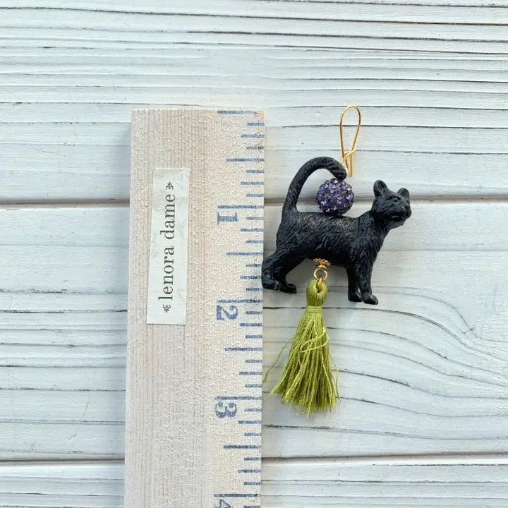 black cat tassel earrings with ruler