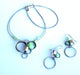 wire necklaces and earrings featuring green beads and gemstones