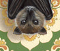 Framed art print of a bat hanging upside down against retro floral pattern background