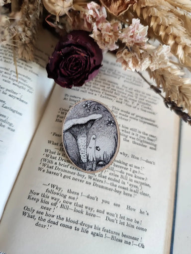 wooden pin with Ghost standing near a mushroom 