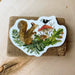 squirrel with a bird on a mushroom sticker