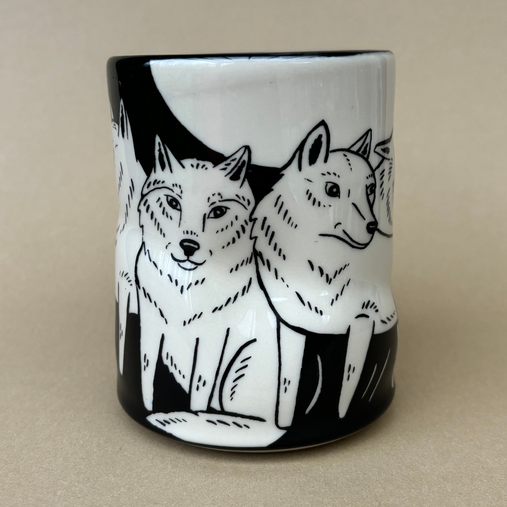 Lucky Wolf Cup - XLarge featuring detailed illustrations of wolves on a ceramic mug, crafted by The Bowl Maker.