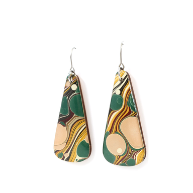 A close-up view of green, yellow, pink, and beige mid-century modern long earrings made from hand marbled UK paper and coated with UV-cured resin.