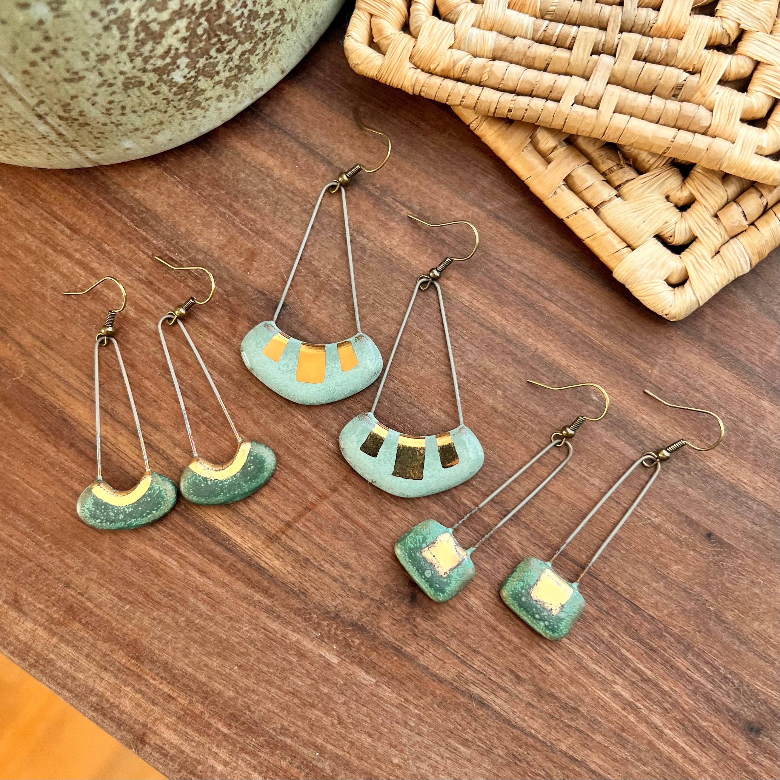 Turquoise and Gold Collar Earrings by The Artifact House, a stunning collection of handcrafted earrings displayed together, emphasizing the intricate turquoise glaze and gold details.