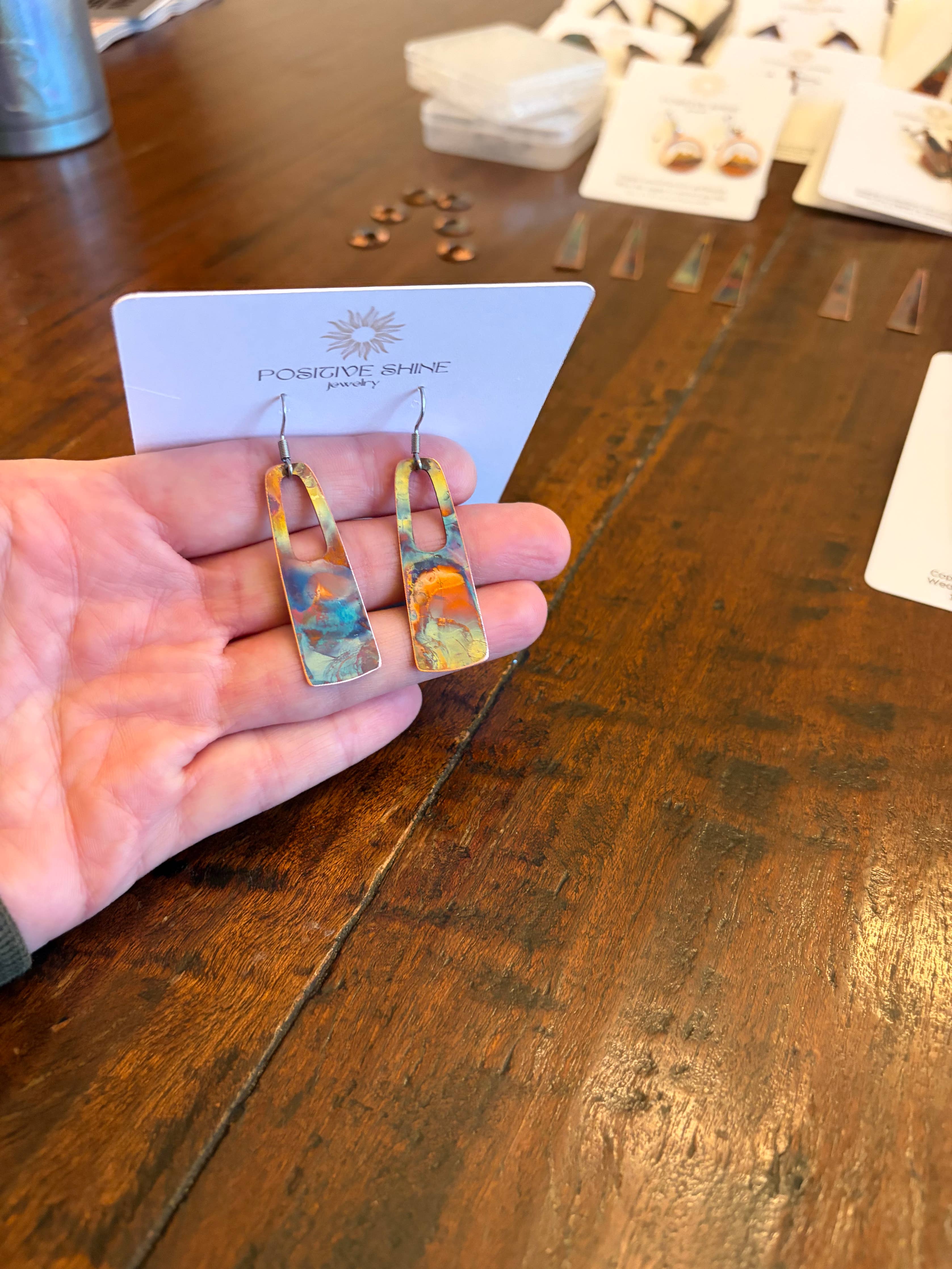 Stylish copper fire painted rectangle earrings with hole designed by Positive Shine Jewelry, showcasing lightweight dangles ideal for everyday wear.