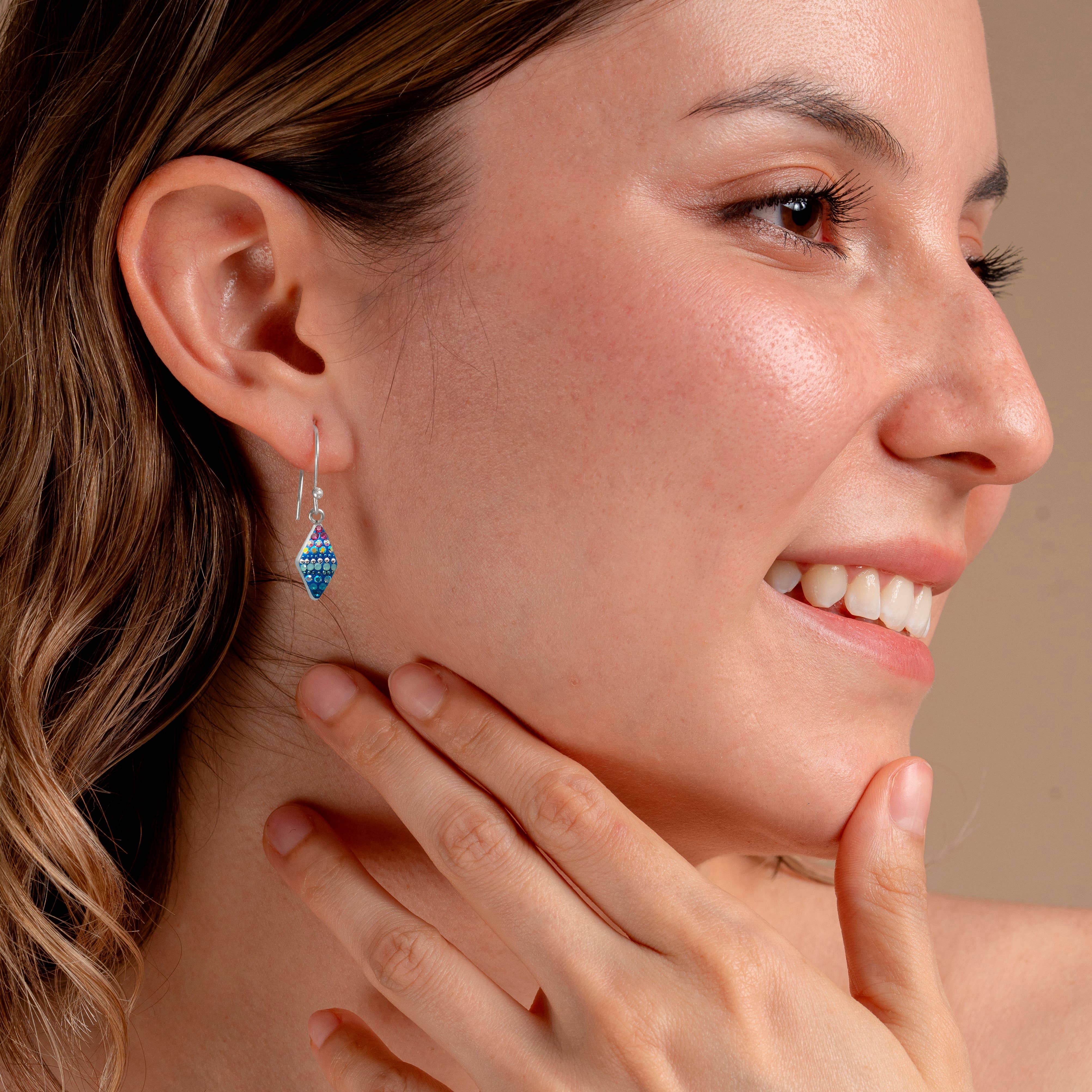 Stylish Crystal Rhombus Earrings elegantly displayed, emphasizing their light-catching sparkle and refined look.
