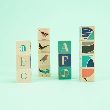 Uncle Goose Bird Blocks featuring a charming bird close-up and colorful Art Nouveau letters, perfect for playful learning and inspired by nature.