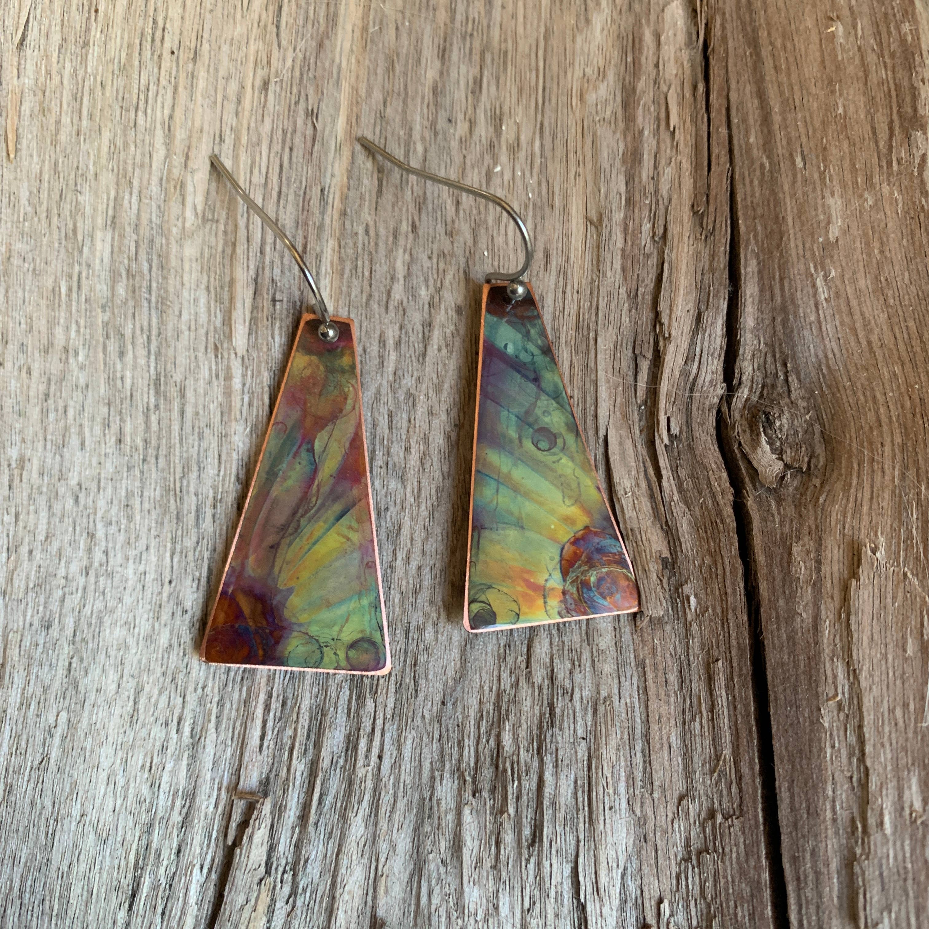 Close-up of Triangle Dangle Earrings Flower displaying unique fire-painted copper design and stainless steel earwires.