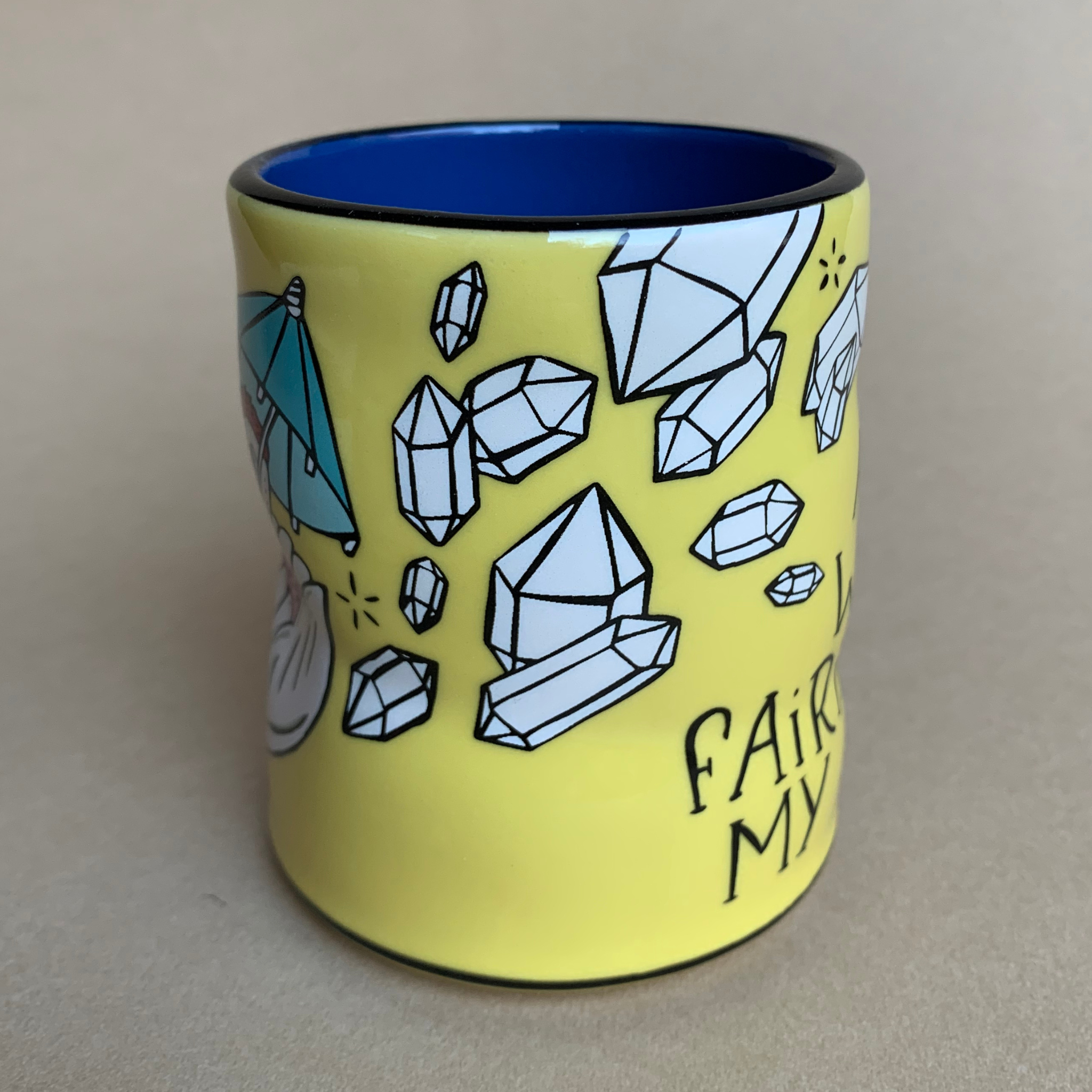 yellow ceramic coffee mug