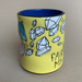 yellow ceramic coffee mug