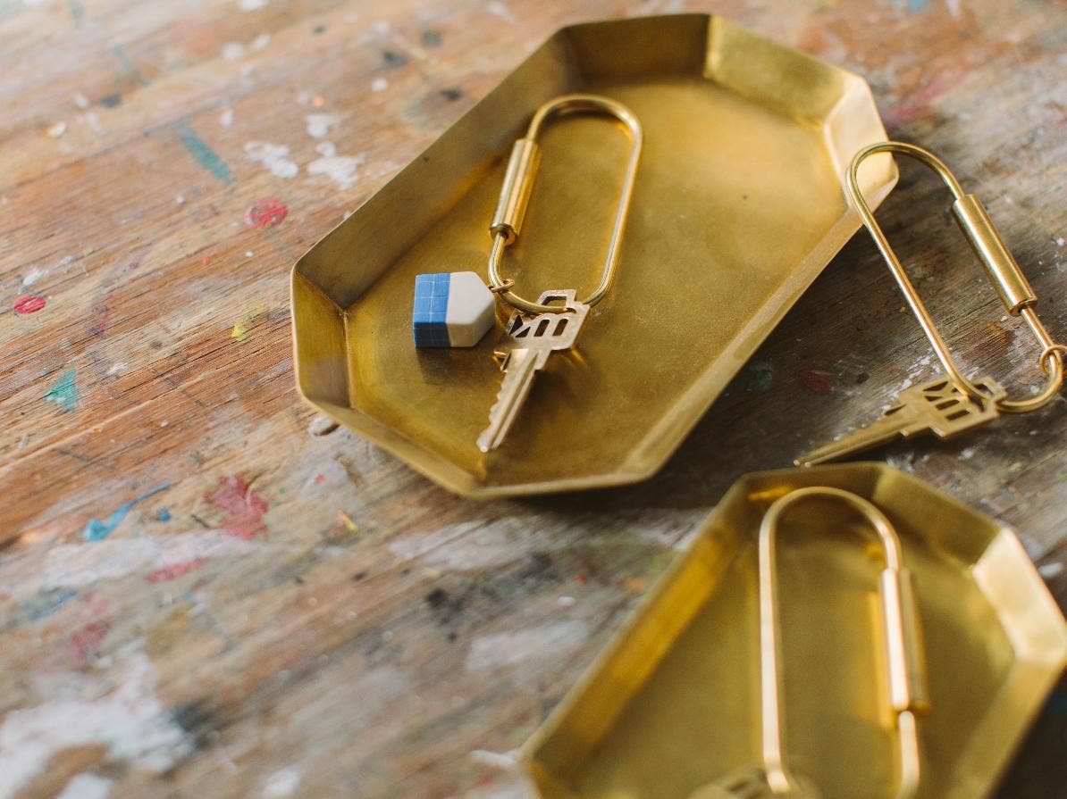 House key ring in gold tray