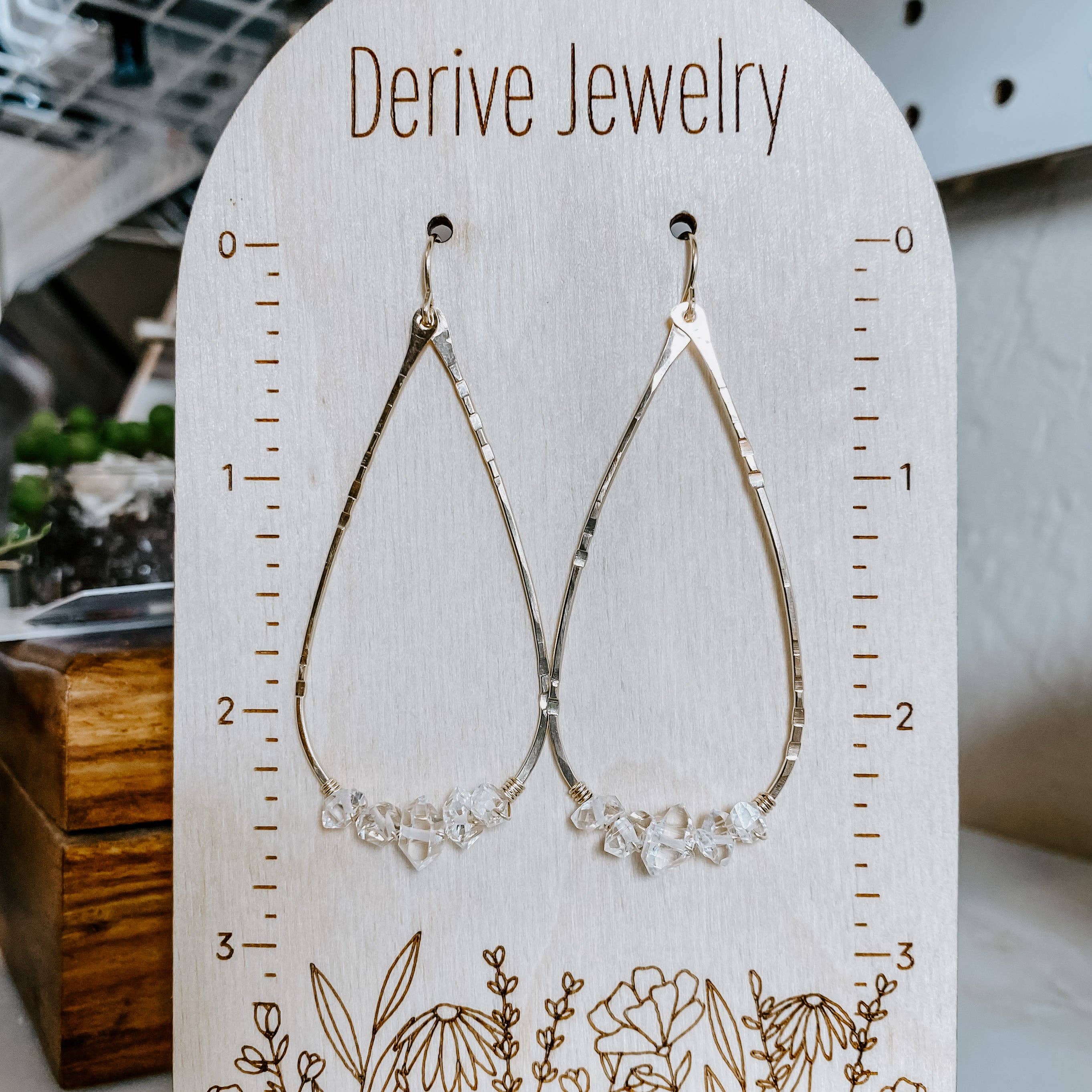 A close-up of Herkimer Diamond Teardrop Earrings, showcasing their shine—perfect for tricking people into thinking you have a personal stylist!