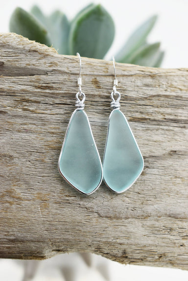 Organic solo drop glass earrings showcasing eco-friendly materials in a stunning turquoise blue color.