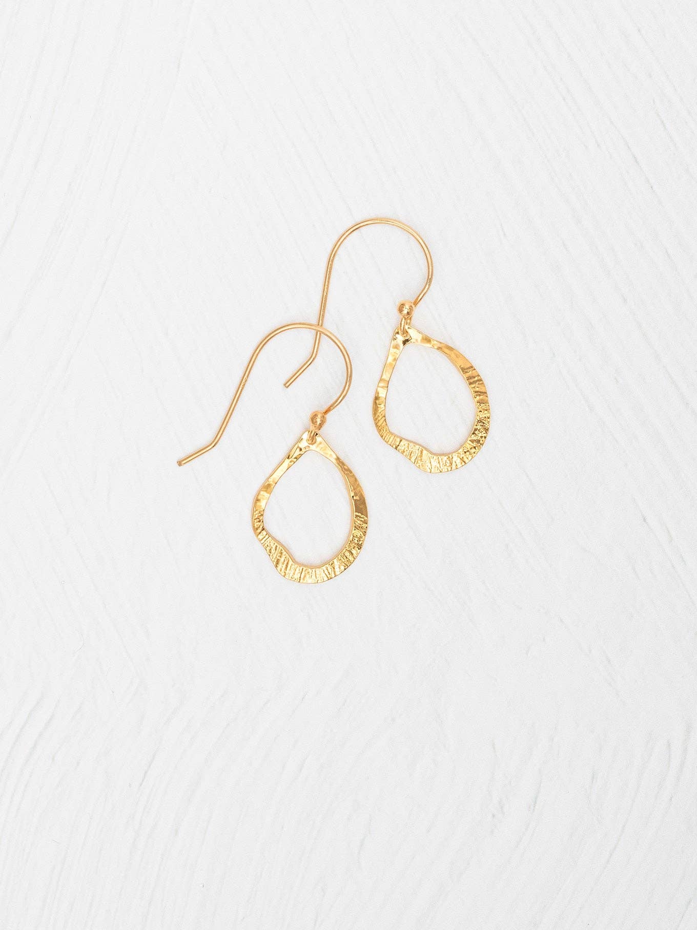 Nina Earrings by Holly Yashi - 18K gold-plated hoops that make you feel like a superstar, even if your cat thinks otherwise.