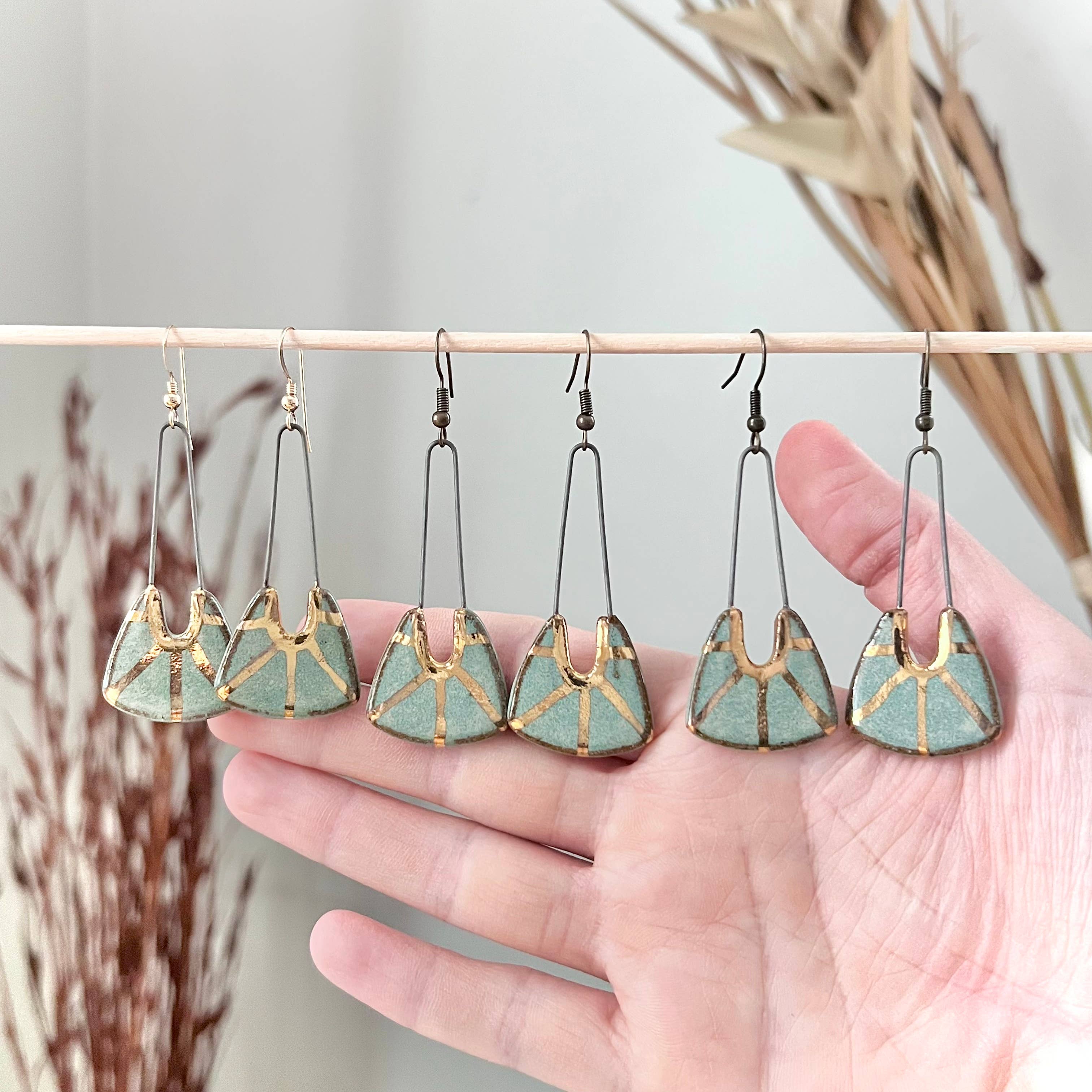 Turquoise Dropped Stoneware Earrings with Gold Sun Design