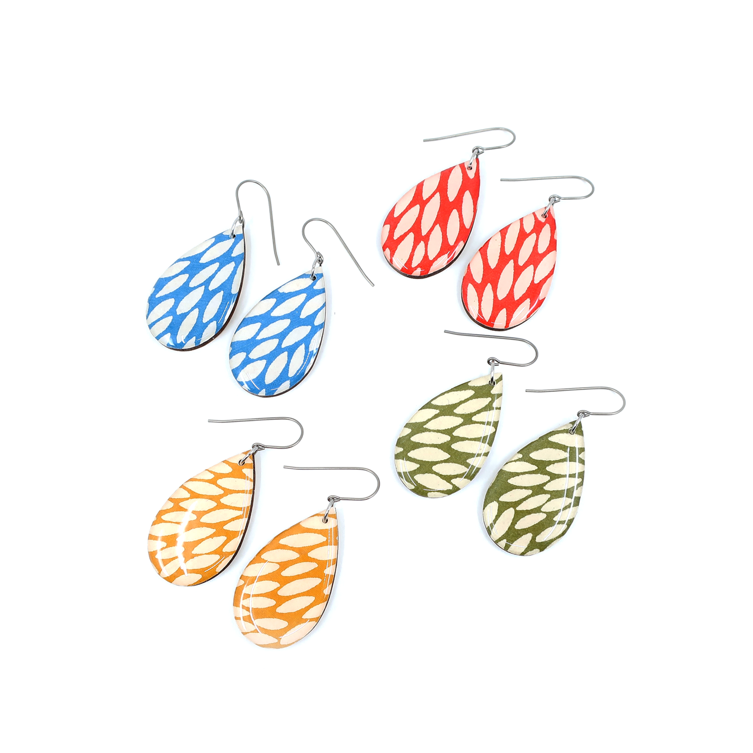 Side view of Teardrop burst Chiyogami titanium earrings in red, illustrating the lightweight design for comfortable wear.