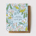 A delightful Root & Branch Card Collection captured in a charming display, featuring recycled paper cards nestled in a kraft envelope, ready to bring smiles and laughs!