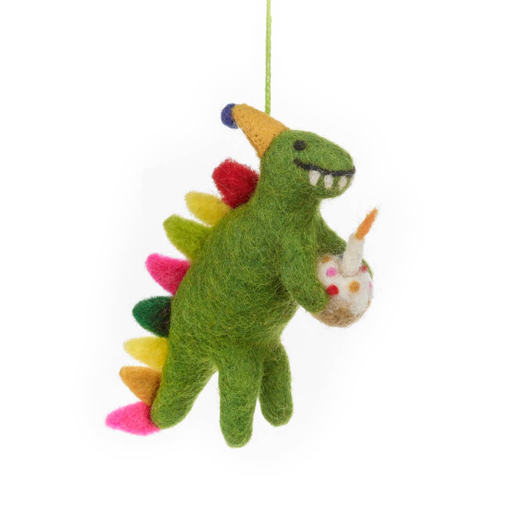 Colorful dinosaur ornament holding a birthday cupcake with a candle
