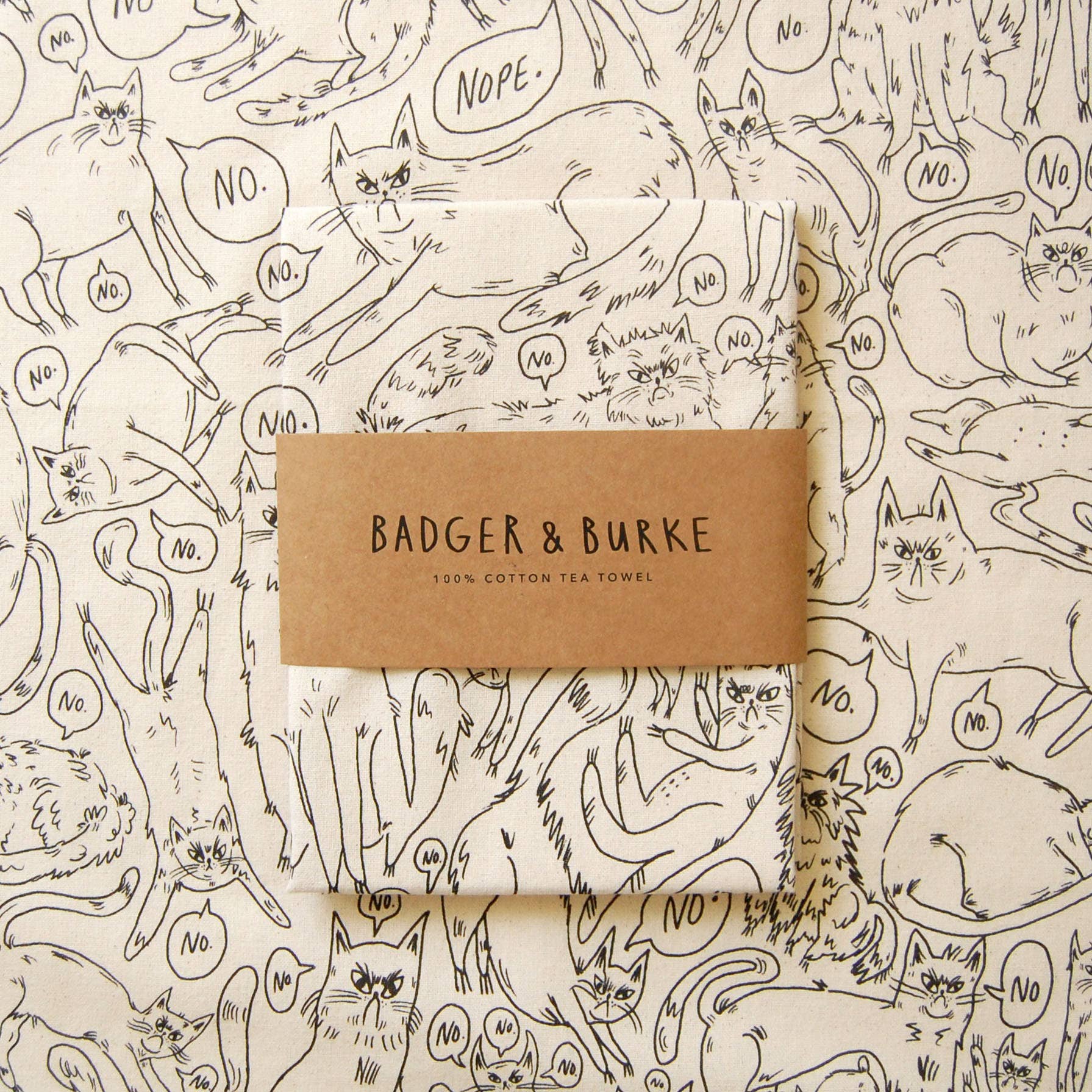 tea towel with cat pattern and 'Badger & Burke' branding 