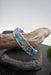 Stylish display of the modern wire woven eco glass cuff bracelet, emphasizing its open cuff design and coastal-inspired textures, ideal for boutique jewelry collections.
