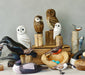 Various hand crafted wooden birds including a Blue Jay by vendor Aviologie, showcasing intricate details and sustainable design.