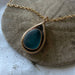 Mermaid Tear Necklace worn by a model, embodying the coastal charm of California with this unique sea glass jewelry.