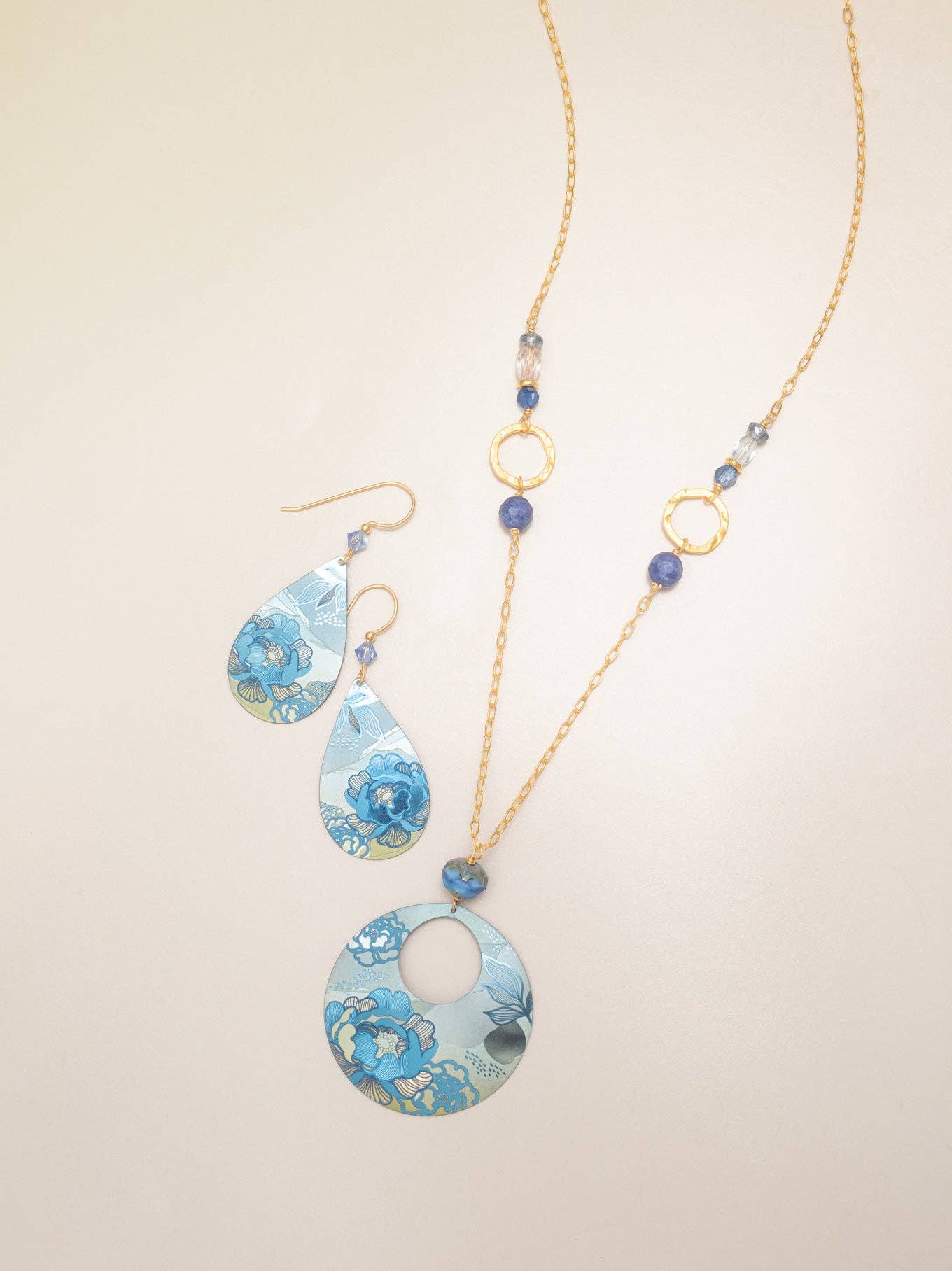 Cynthia Earrings: Measuring 2" x 3/4", these whimsical niobium earrings add a touch of floral artistry to your outfit, guaranteed to impress and amuse!