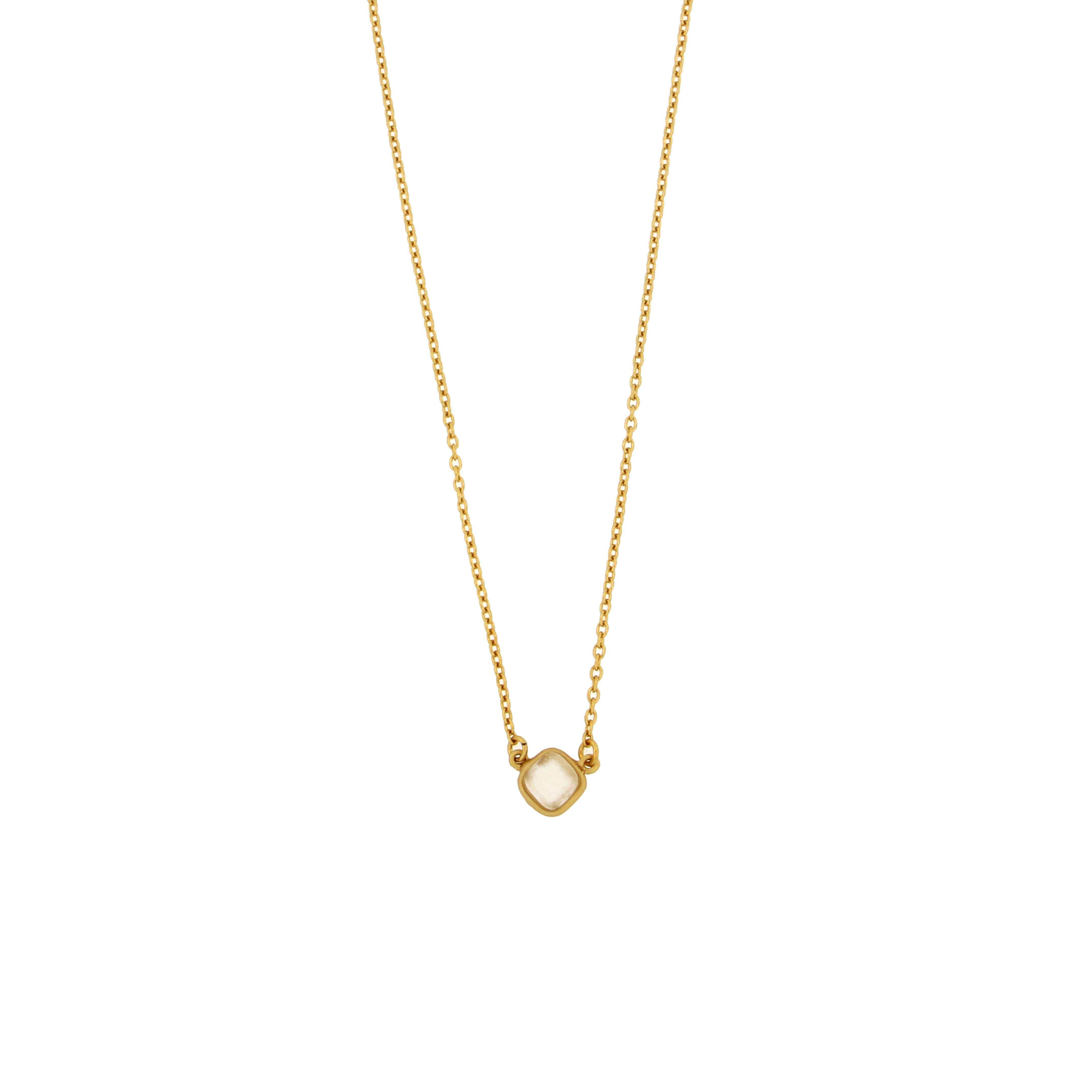 Showcasing the Bubble Diamond 16" Adj. Dainty Pendant in a chic setting, proving that classy jewelry can also bring a pop of fun!