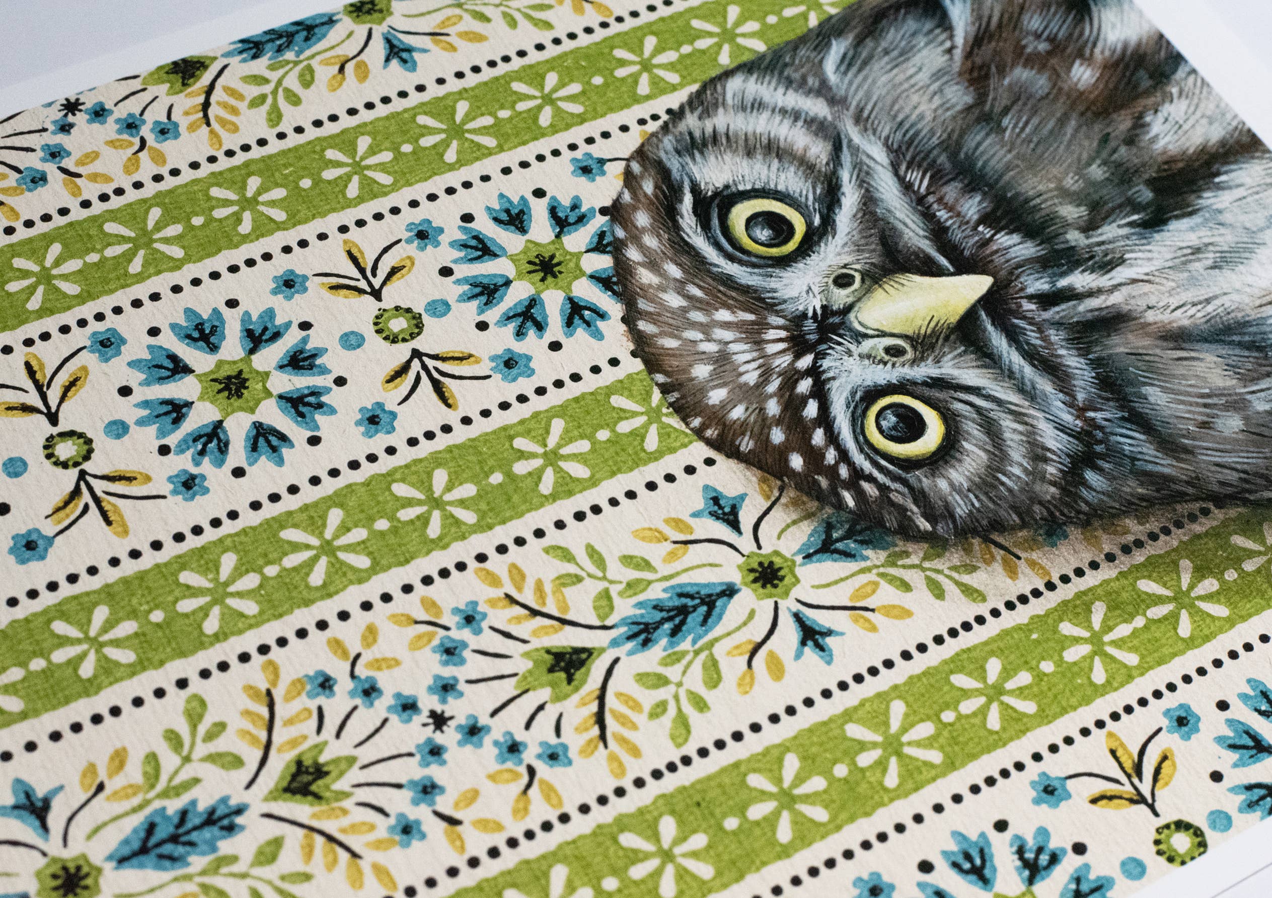 Framed art print of an owl on a patterned background