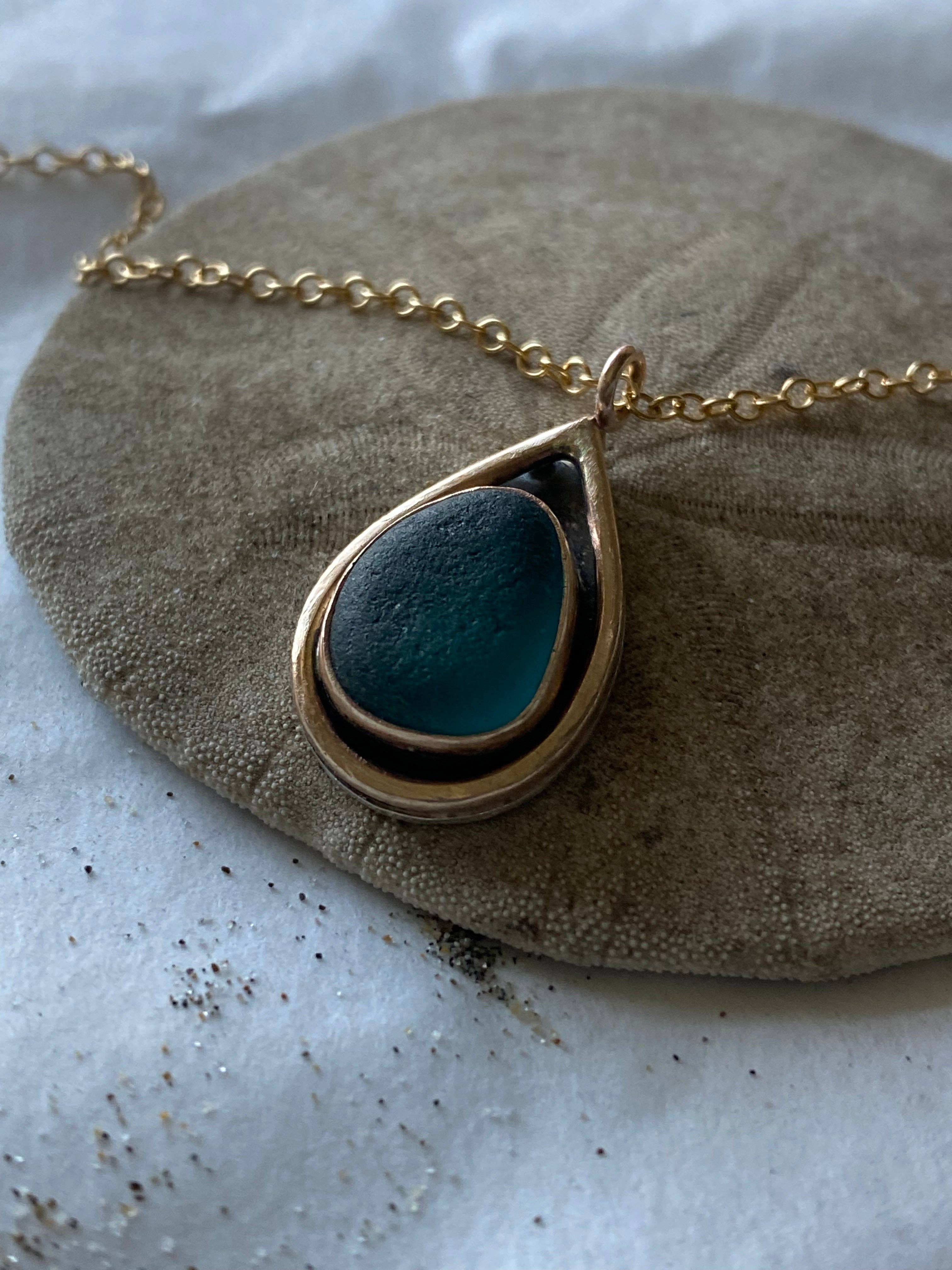 Beautiful Mermaid Tear Necklace featuring authentic sea glass pendant, handcrafted sterling silver bezel, and warm 14k gold fill accents.