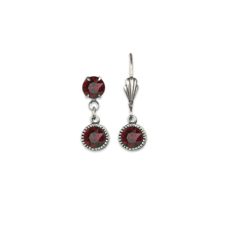 Pair of silver drop earrings with red gemstones