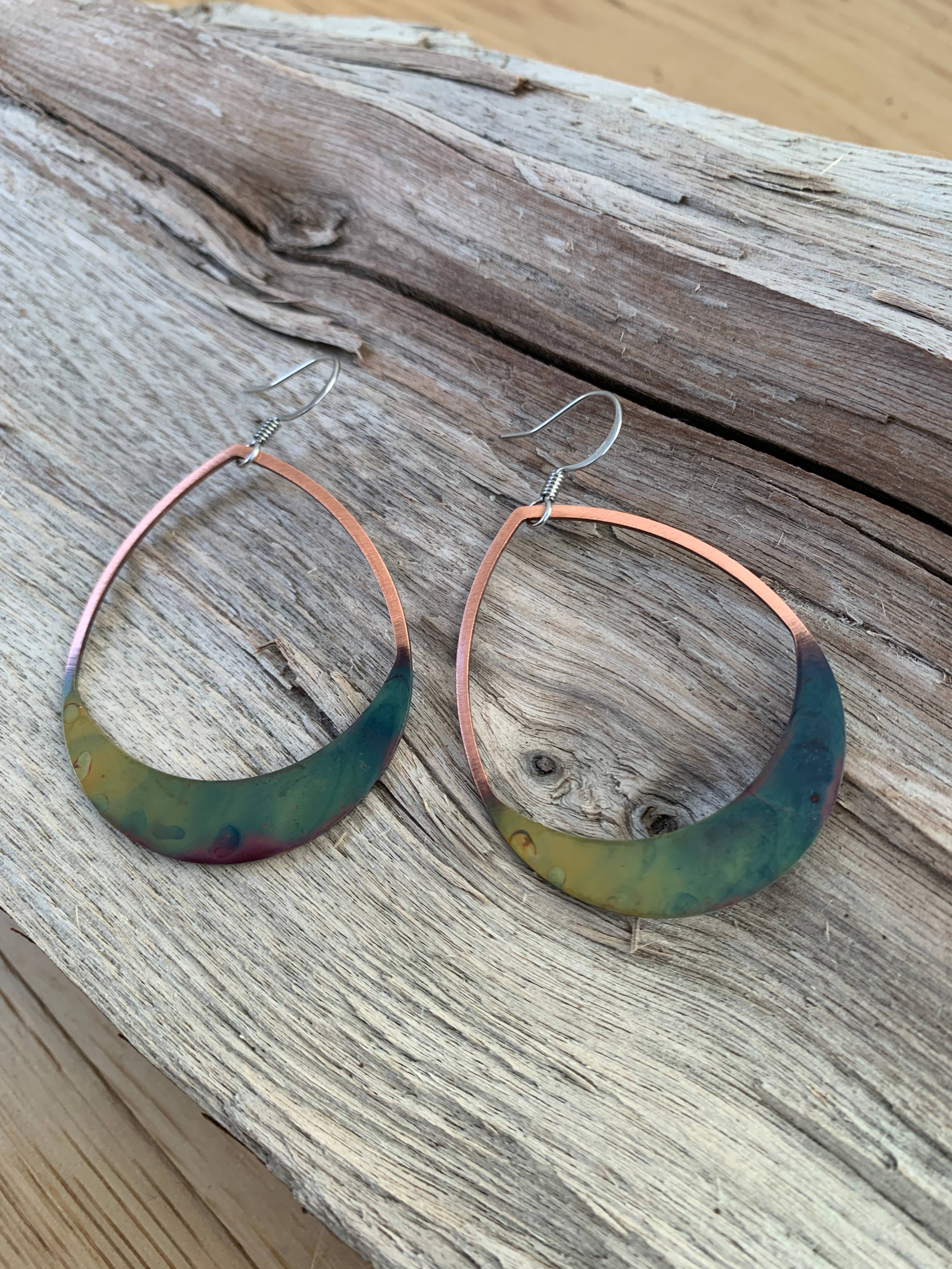 Wearing Rounded Teardrop Fire Painted Copper Earrings styled casually, demonstrating their light and airy feel, ideal for enhancing any outfit.