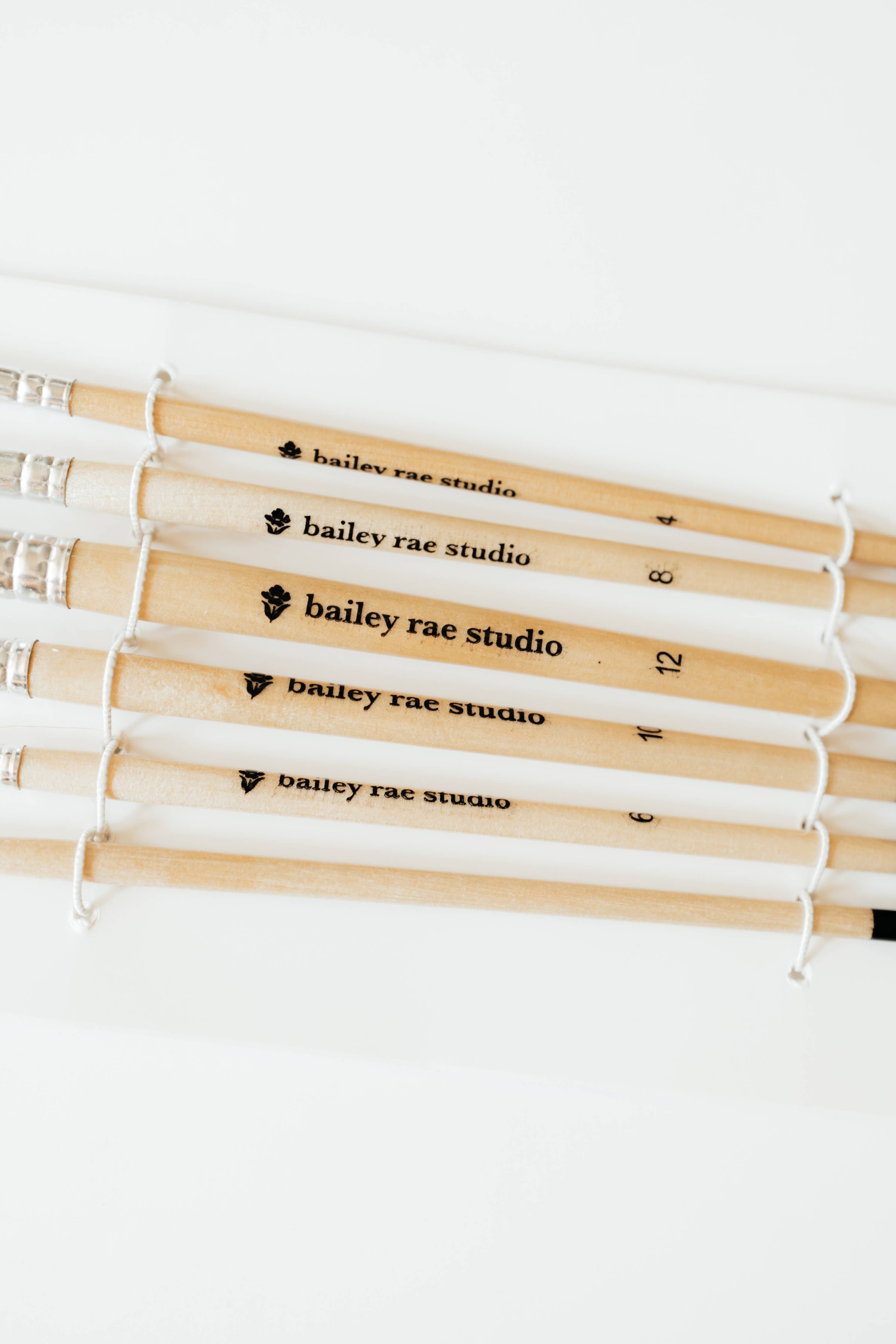 Artist using the Round Tip Watercolor Brush Set during a painting workshop, highlighting its effectiveness for beginners and experienced artists.