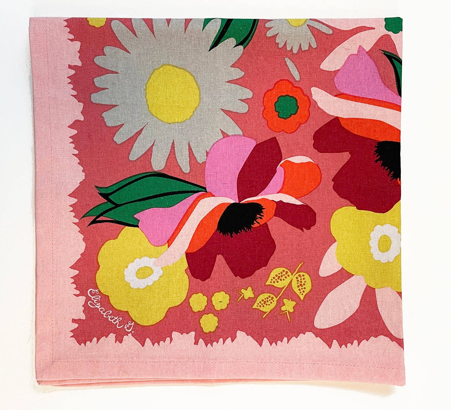 Stylish arrangement of the Garden Napkin Set of 4 on a rustic wooden table.
