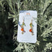 Whimsical Wildflower Earrings featuring a tiny bee charm, adorned with vibrant gems like carnelian and tourmaline, making your ear game the bee's knees!