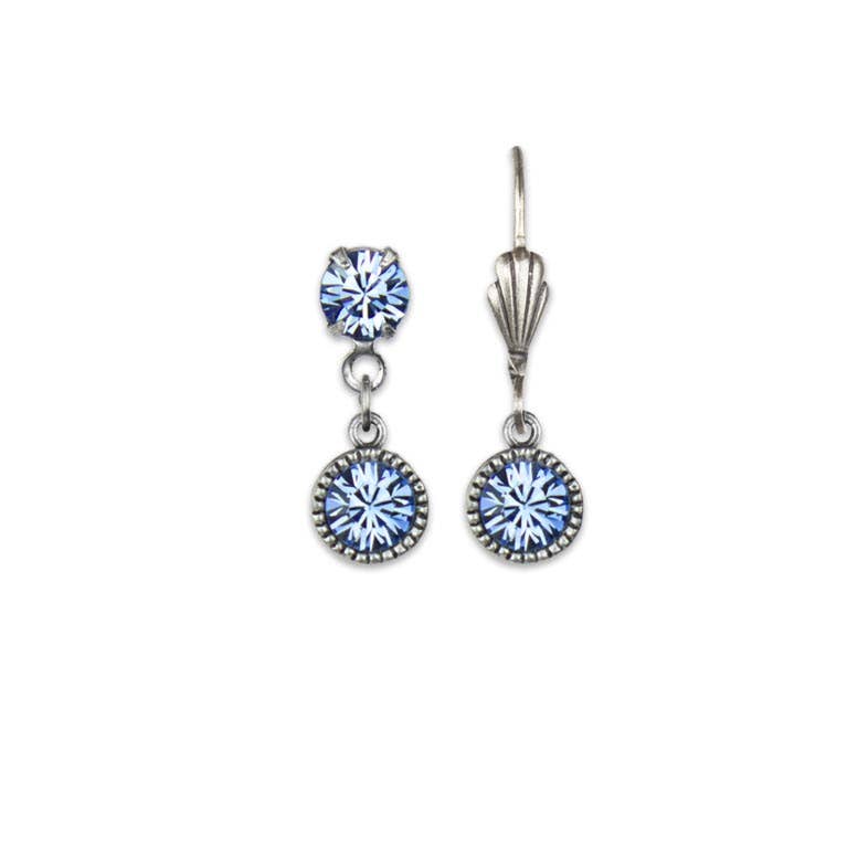 Pair of silver earrings with blue gemstones