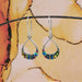 Round Moon Drop Earrings displayed elegantly, capturing the magic of lunar phases for everyday wear.