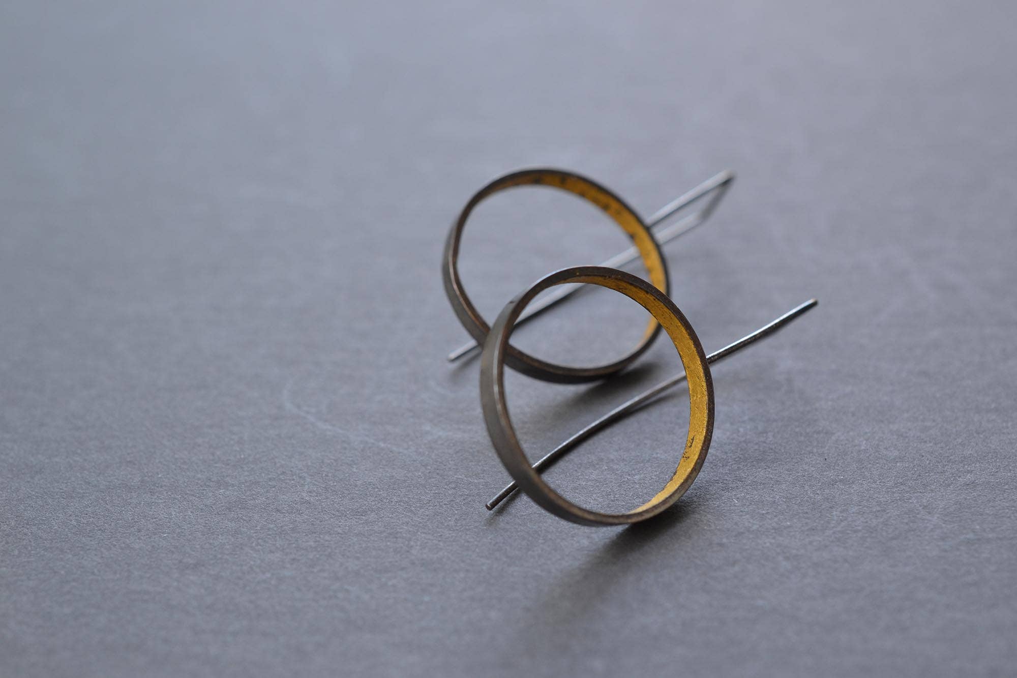 Glamorous Modern Gold & Silver Circle Hoop Earrings that hide a fabulous secret of yellow gold, perfect for adding a touch of playful elegance to any ensemble!