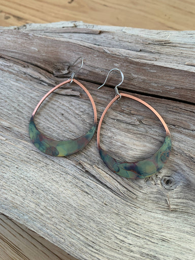 Close-up view of Rounded Teardrop Fire Painted Copper Earrings showcasing vibrant colors and stainless steel ear wires, an eye-catching piece by Positive Shine Jewelry.
