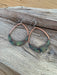 Close-up view of Rounded Teardrop Fire Painted Copper Earrings showcasing vibrant colors and stainless steel ear wires, an eye-catching piece by Positive Shine Jewelry.