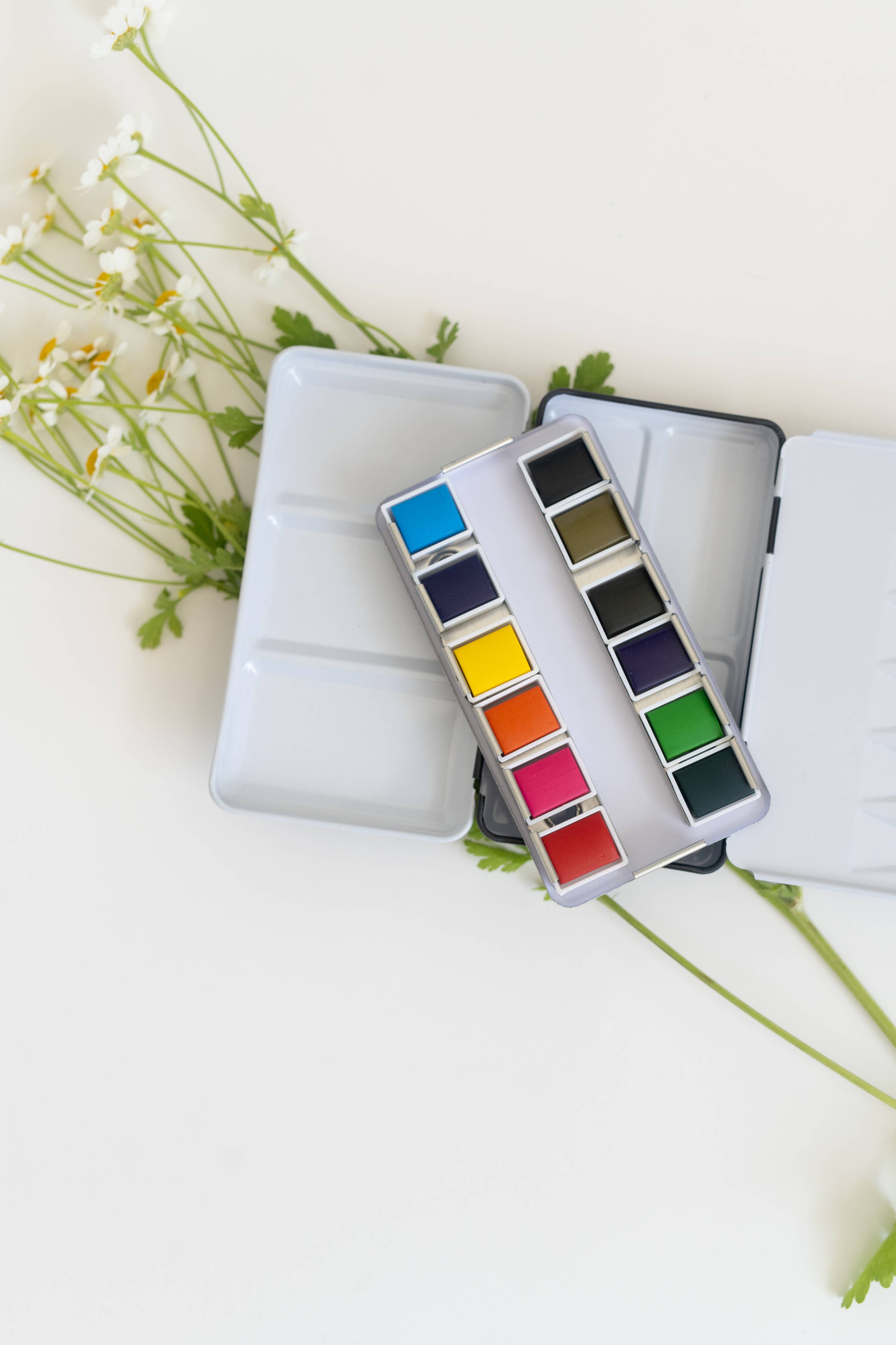 User-friendly 12 Color Mini-Travel Watercolor Paint Palette designed for artists of all skill levels, showcasing portability.
