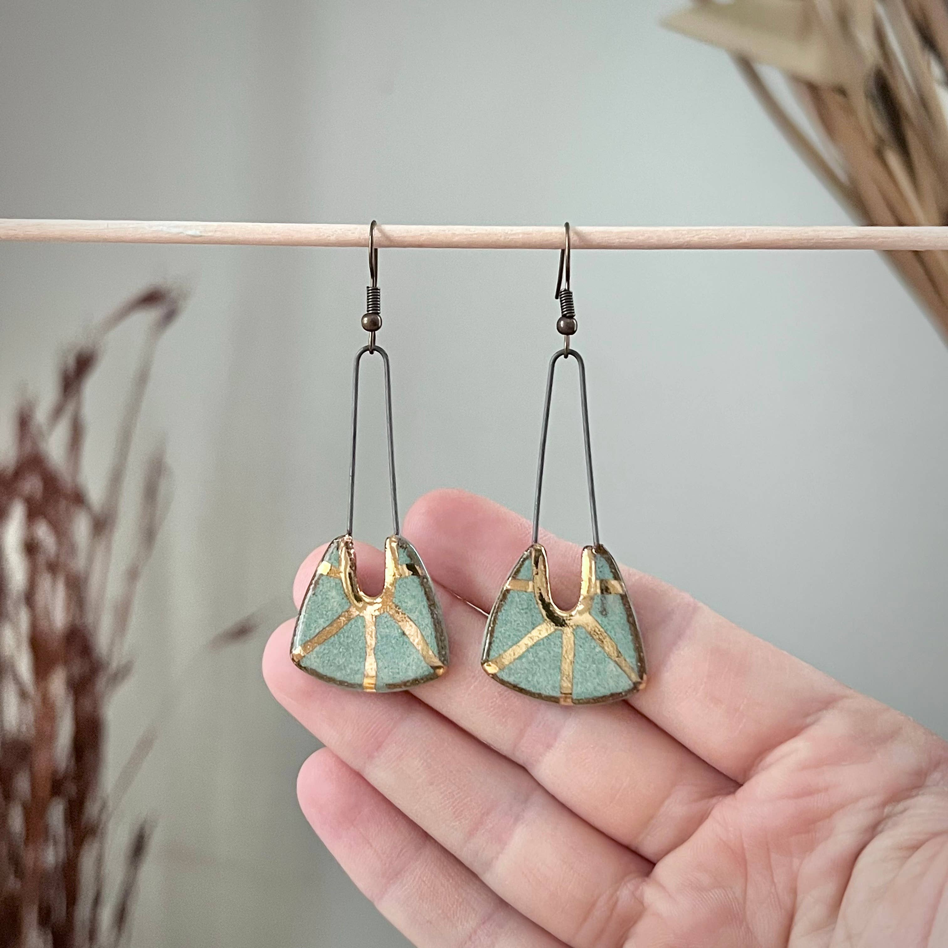 Turquoise Dropped Stoneware Earrings with Gold Sun Design