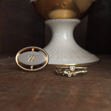 Gold ring with a diamond and a gold oval pendant 