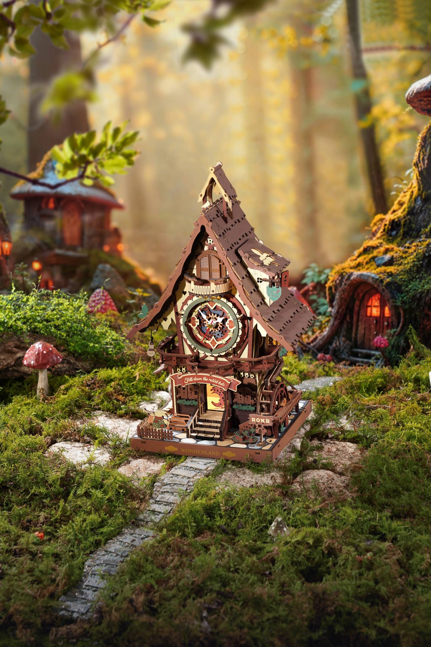 Cuckoo Clock DIY Wooden Puzzle by Hands Craft, illustrated in a serene natural setting with moss and whimsical mushrooms, showcasing its fairy tale cottage design and intricate craftsmanship.