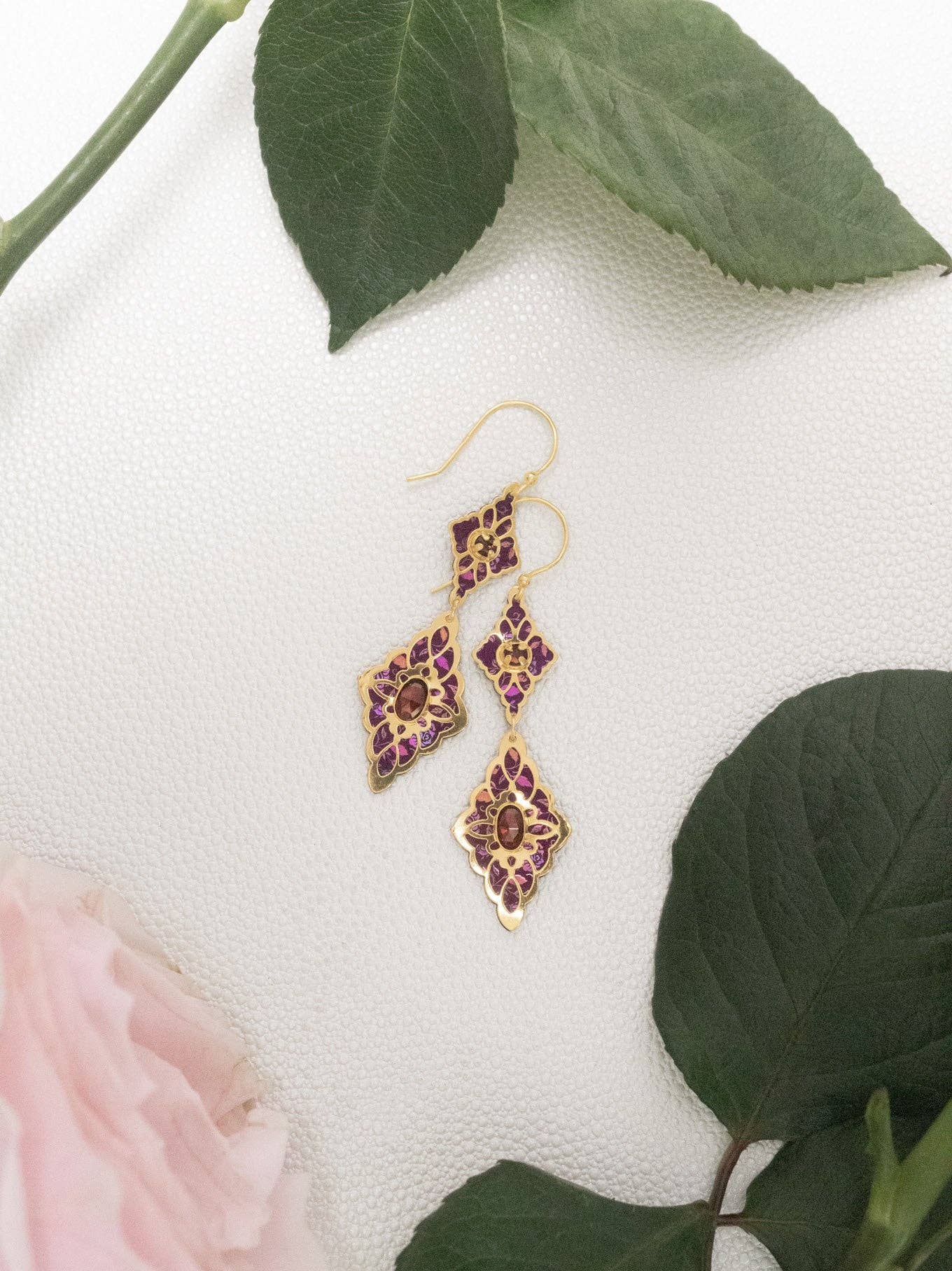 Esmeralda Earrings - These charming double-tiered earrings dance with intricately designed niobium florals and garnet stones, perfect for when you want to say 'look at me'! 