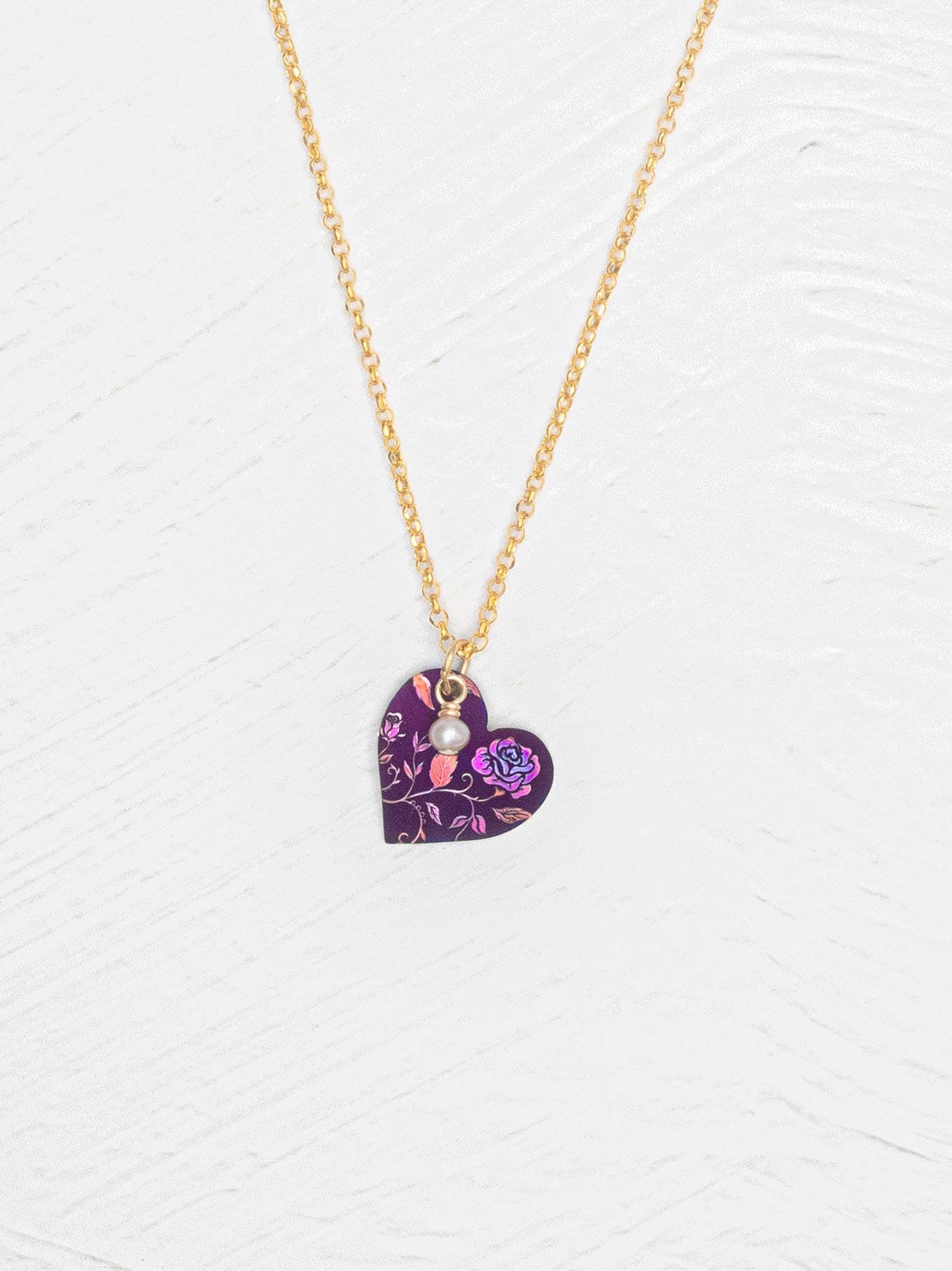 Budding Heart Pendant: It's not just jewelry; it's a tiny love declaration hanging around your neck, making hearts skip like a school kid at recess.